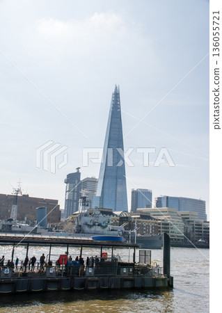 The Shard, a glass skyscraper towering over the River Thames in bright sunlight The Shard, a glass skyscraper towering over the River Thames in bright sunlight 136055721
