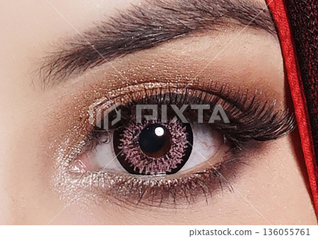 striking close up of a woman eyes accentuated by pink contact lenses, bold lashes, and shimmering makeup. Red framing the gaze, conveying fashion, confidence, and contemporary beauty striking close up of a woman eyes accentuated by pink contact lenses, bold lashes, and shimmering makeup. Red framing the gaze, conveying fashion, confidence, and contemporary beauty 136055761