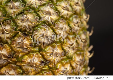 juicy ripe unpeeled pineapple , yellow and green hard peel of ripe pineapple juicy ripe unpeeled pineapple , yellow and green hard peel of ripe pineapple 136055938