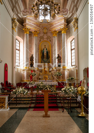 altar in catholic cathedral beautifully decorated with flowers 136056497