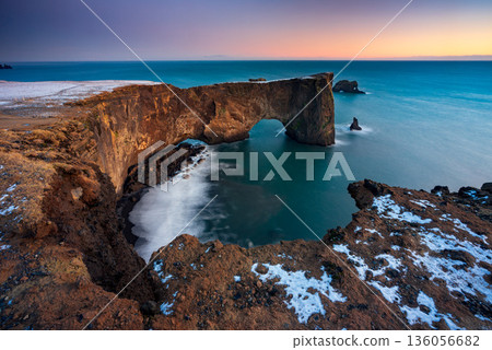 Sunrise over Sea arch at Dyrholaey peninsula , South of Iceland 136056682