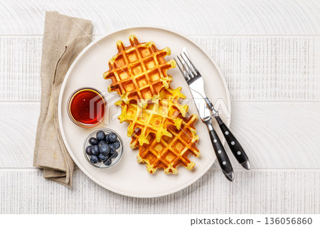 Homemade waffles with maple syrup 136056860