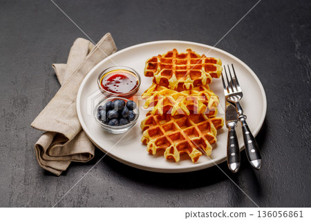 Homemade waffles with maple syrup 136056861