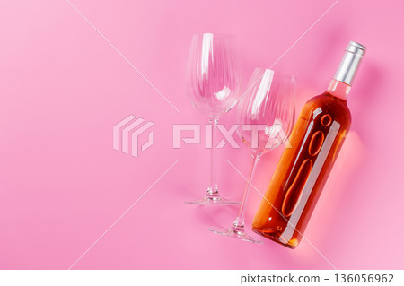 Rose wine and wine glasses on pink background Rose wine and wine glasses on pink background 136056962