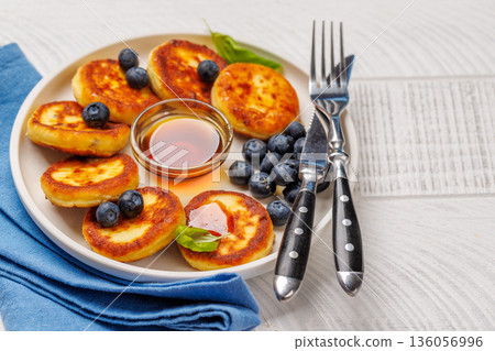 Homemade pancakes with blueberries and syrup 136056996