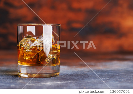 Glass of whiskey with ice 136057001