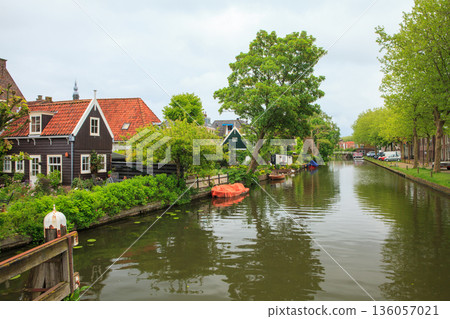 Dutch village with houses by canal Dutch village with houses by canal 136057021
