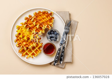 Homemade waffles with maple syrup Homemade waffles with maple syrup 136057028