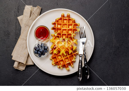 Homemade waffles with maple syrup 136057030