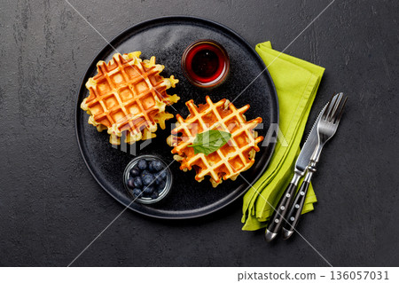 Homemade waffles with maple syrup 136057031