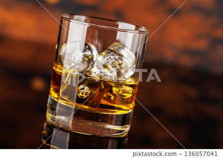 Glass of whiskey with ice Glass of whiskey with ice 136057041