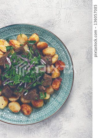 kuyrdak, roast offal with potatoes and fresh herbs, homemade in Kazakh, no people, kuyrdak, roast offal with potatoes and fresh herbs, homemade in Kazakh, no people, 136057085