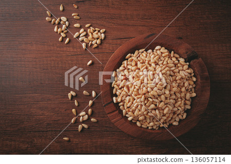 peeled pine nuts, in a wooden bowl, on a wooden table, close-up, no people, peeled pine nuts, in a wooden bowl, on a wooden table, close-up, no people, 136057114