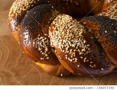 Sweet Slavic bun made in the shape of a ring and called Kalach 136057340