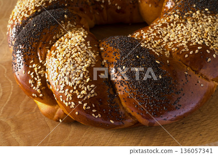 Sweet Slavic bun made in the shape of a ring and called Kalach 136057341