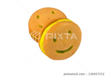 Smile cookies with banana filling on a white background in isolation Smile cookies with banana filling on a white background in isolation 136057352