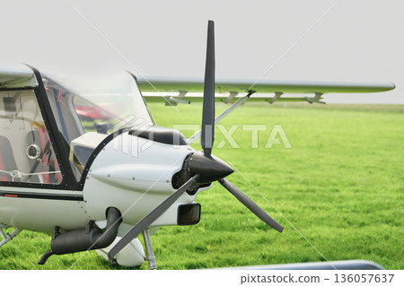 The white gyrocopter at the airfield The white gyrocopter at the airfield 136057637