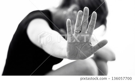 A woman's outstretched hand illustrating a self-defense situation. Stop violence against women. International Women's Day 136057700