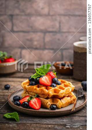 Tasty Belgian waffles with fresh berries 136057767