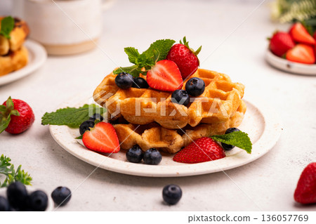 Tasty Belgian waffles with fresh berries 136057769