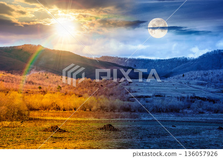 early spring rural landscape in mountains. day and night time change concept. beautiful view of countryside scenery with field in march with sun and moon at twilight. equality and shift template early spring rural landscape in mountains. day and night time change concept. beautiful view of countryside scenery with field in march with sun and moon at twilight. equality and shift template 136057926