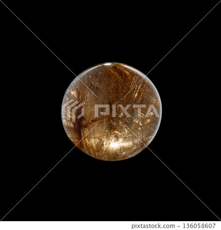 Ball of quartz with rutile on a black background 136058607