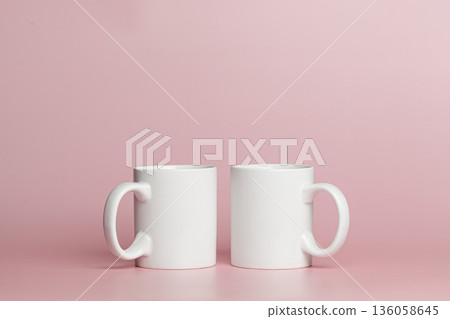 white cups for tea or coffee on a pink background white cups for tea or coffee on a pink background 136058645