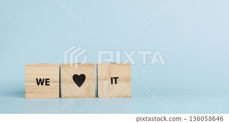 Wooden cubes with inscriptions We Love It on a blue background 136058646