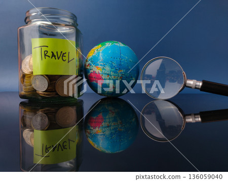 Word travel, including a savings jar, a globe, and a magnifying glass. 136059040