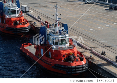 Harbor tugboats moored at quay in Messina port, Italy Harbor tugboats moored at quay in Messina port, Italy 136059081