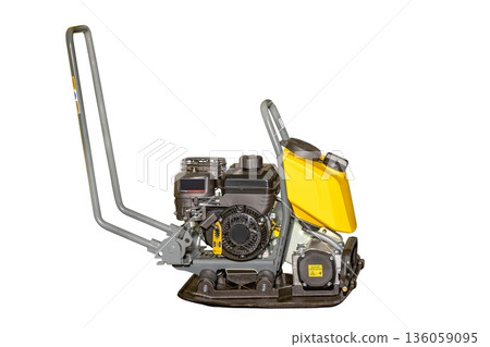 Powerful compactor ready for construction tasks at a building site during the day. Isolated on white background. Powerful compactor ready for construction tasks at a building site during the day. Isolated on white background. 136059095