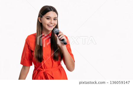 photo of singer teen girl hold microphone, copy space. teen girl singer singing with microphone photo of singer teen girl hold microphone, copy space. teen girl singer singing with microphone 136059147