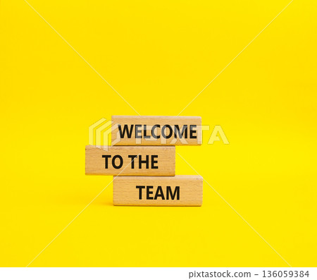 Team symbol. Wooden blocks with words Welcome to the Team. Beautiful yellow background. Business and Welcome to the Team concept. Copy space. Team symbol. Wooden blocks with words Welcome to the Team. Beautiful yellow background. Business and Welcome to the Team concept. Copy space. 136059384