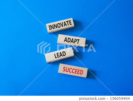 Innovate Adapt Lead Succeed symbol. Concept words Innovate Adapt Lead Succeed on wooden blocks. Beautiful bright blue background. Business and Innovate Adapt Lead Succeed concept. Copy space. Innovate Adapt Lead Succeed symbol. Concept words Innovate Adapt Lead Succeed on wooden blocks. Beautiful bright blue background. Business and Innovate Adapt Lead Succeed concept. Copy space. 136059404