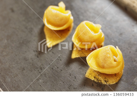 Pasta tortellini on tray 136059433