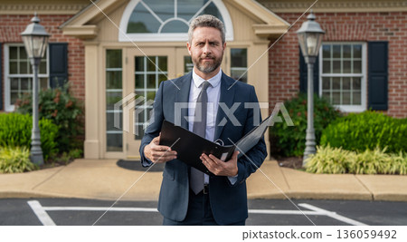 Agent real estate at house for sale. Realtor welcoming visitor. Rent or buy new home. Home insure. Property insurance promotion. Successful broker make offer. Mortgage insurer. American sales manager 136059492