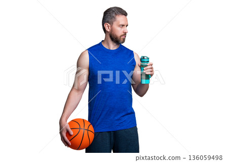 Sport man drinking water. Hydration vitality. Be hydrated. Thirsty sportsman. Thirsty man drink water. Basketball player man with sport bottle. Healthy lifestyle. Water balance in body. Refreshment Sport man drinking water. Hydration vitality. Be hydrated. Thirsty sportsman. Thirsty man drink water. Basketball player man with sport bottle. Healthy lifestyle. Water balance in body. Refreshment 136059498
