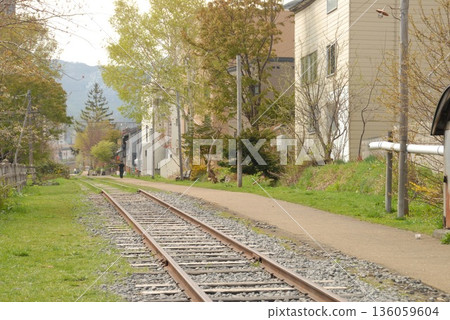 Scenery and roads along the railway in a quiet town 136059604
