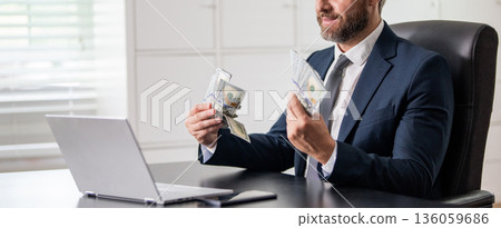 Business success. Businessman count money at office desk. Business man freelancer count dollar at office. Ambitious entrepreneur count money. Successful invest money in business. Cropped view Business success. Businessman count money at office desk. Business man freelancer count dollar at office. Ambitious entrepreneur count money. Successful invest money in business. Cropped view 136059686