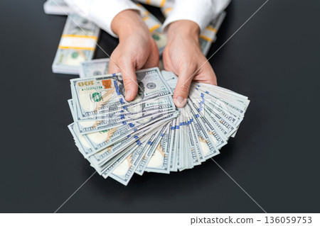 Financial saving success. Successful rich man with money. Business success man hold dollar. Millionaire hold dollar money. Riches and success. Rich businessman saving cash money 136059753
