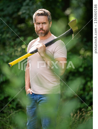 Brutal lumberjack. Brutality and masculinity. Hispanic lumberjack man with axe. Lumberjack axe. Man with logging axe. Hardworking brutal man. Lumberjack hardworking outdoor, selective focus Brutal lumberjack. Brutality and masculinity. Hispanic lumberjack man with axe. Lumberjack axe. Man with logging axe. Hardworking brutal man. Lumberjack hardworking outdoor, selective focus 136060586