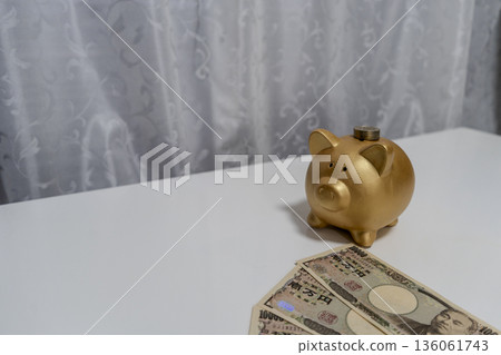 Piggy bank with money Piggy bank with money 136061743