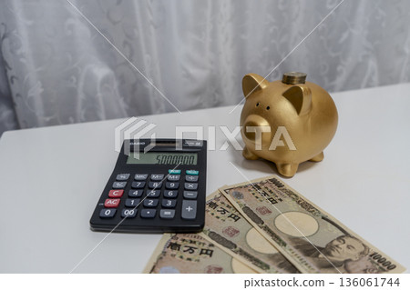 Pig money box and calculator calculating money 136061744
