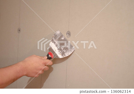 Drywall Surface Repair with Putty Knife Drywall Surface Repair with Putty Knife 136062314