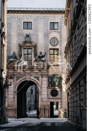 Historic Residenzstrasse Near Odeonsplatz In Munich: Ornate Baroque Facade With Sculptural Details, Arched Passageway, And Classical Urban Architecture Historic Residenzstrasse Near Odeonsplatz In Munich: Ornate Baroque Facade With Sculptural Details, Arched Passageway, And Classical Urban Architecture 136062363