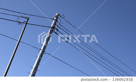 Utility poles and blue sky Utility poles and blue sky 136062938