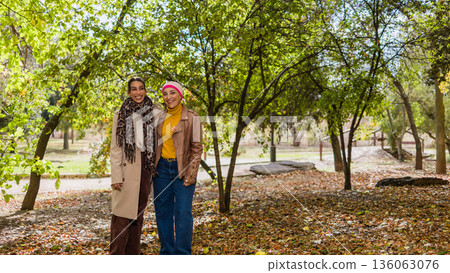 Cancer survivor mother and daughter enjoying park Cancer survivor mother and daughter enjoying park 136063076
