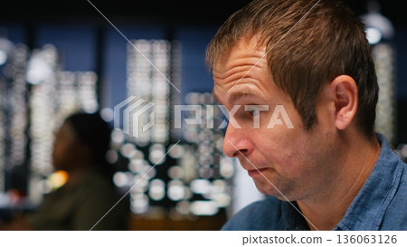 Designer dealing with stress and pressure to produce a virtual home layout, being overwhelmed and anxious. Architectural software enables 3D modeling and rendering, workload. Camera B. 136063126