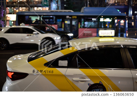 KakaoT taxi at night on a busy street in downtown Seoul, South Korea KakaoT taxi at night on a busy street in downtown Seoul, South Korea 136063650
