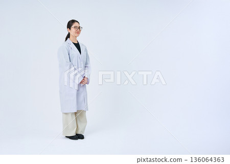 A young lady in a white suit A young lady in a white suit 136064363
